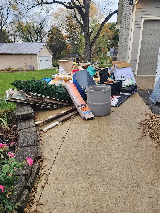 Dumpster being loaded with debris for Commercial Dumpster Rental in Thomasville